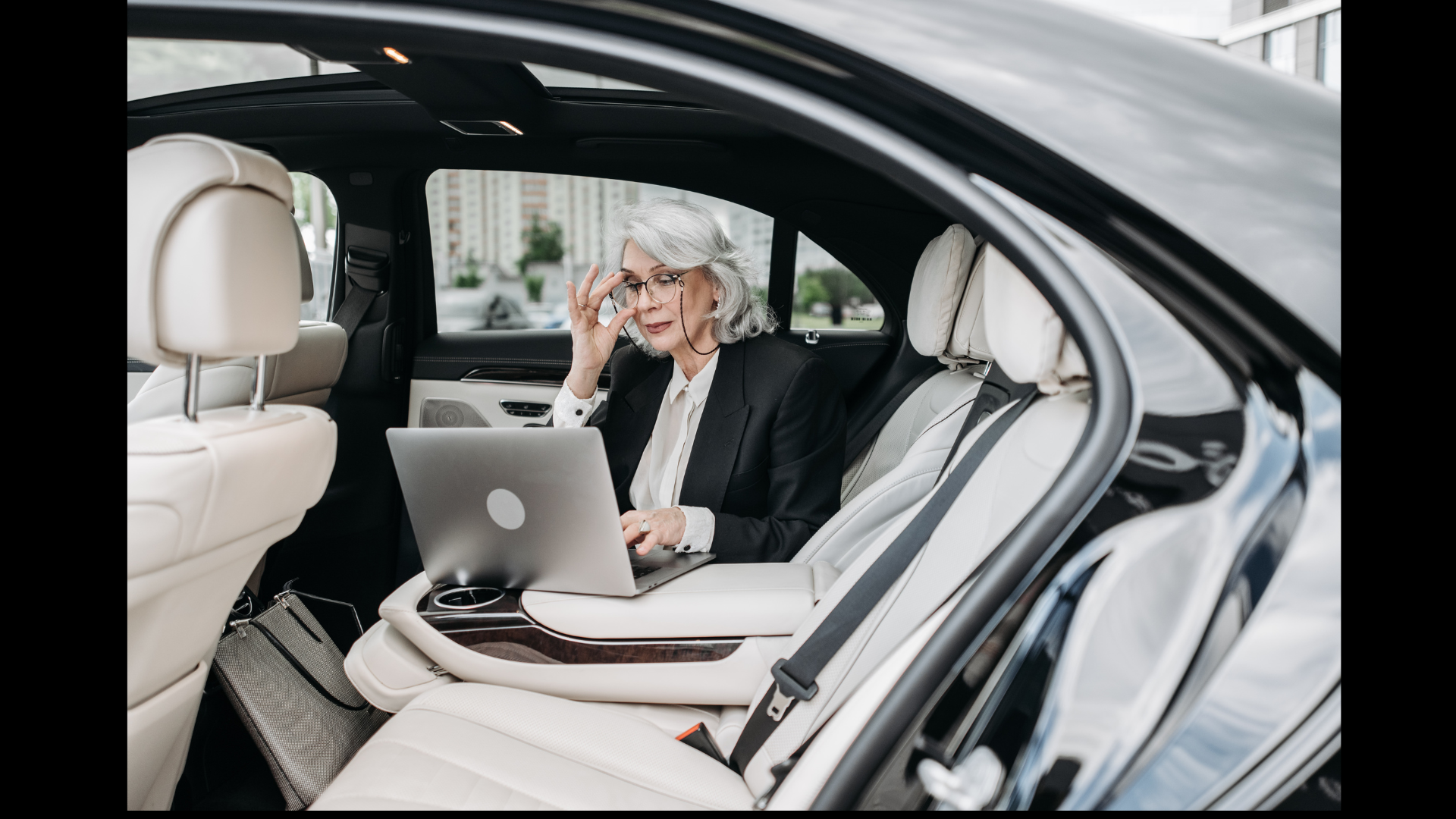 corporate business woman in her luxury car