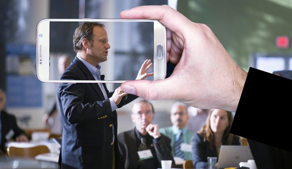 video recording, conference, public speaking, presentation, lecture, speaker, man, smartphone, screen, horizontal, technology, display, device, mobile, hand, holding, social media, business, live, communication, white, public speaking, public speaking, public speaking, public speaking, public speaking, lecture, speaker, speaker, speaker